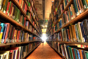 Image of bookshelves on left and right with light shining in the center