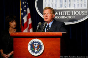 Martin Sheen as Jed Barlet standing at the podium with Presidential seal